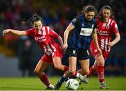 14 October 2023; Roisin Molloy of Athlone Town is tackled by Alice Lillie of Sligo Rovers during the FAI Women's Cup semi-final match between Sligo Rovers and Athlone Town at The Showgrounds in Sligo. Photo by Tyler Miller/Sportsfile