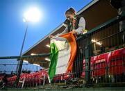 14 October 2023; A Republic of Ireland supporter hangs a tricolour before the UEFA European U17 Championship qualifying round 10 match between Republic of Ireland and Iceland at Turner's Cross in Cork. Photo by Eóin Noonan/Sportsfile
