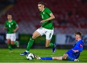 14 October 2023; Niall McAndrews of Republic of Ireland in action against Solvi Stefansson of Iceland during the UEFA European U17 Championship qualifying round 10 match between Republic of Ireland and Iceland at Turner's Cross in Cork. Photo by Eóin Noonan/Sportsfile