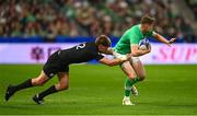 14 October 2023; Garry Ringrose of Ireland is tackled by Jordie Barrett of New Zealand  the 2023 Rugby World Cup quarter-final match between Ireland and New Zealand at the Stade de France in Paris, France. Photo by Harry Murphy/Sportsfile