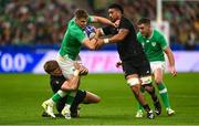 14 October 2023; Garry Ringrose of Ireland is tackled by New Zealand players Jordie Barrett, left, and Ardie Savea during the 2023 Rugby World Cup quarter-final match between Ireland and New Zealand at the Stade de France in Paris, France. Photo by Harry Murphy/Sportsfile