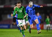 14 October 2023; Mason Melia of Republic of Ireland in action against Egill Ori Arnarsson of Iceland during the UEFA European U17 Championship qualifying round 10 match between Republic of Ireland and Iceland at Turner's Cross in Cork. Photo by Eóin Noonan/Sportsfile