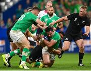 14 October 2023; Hugo Keenan of Ireland is tackled by Ardie Savea of New Zealand during the 2023 Rugby World Cup quarter-final match between Ireland and New Zealand at the Stade de France in Paris, France. Photo by Harry Murphy/Sportsfile