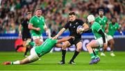 14 October 2023; Beauden Barrett of New Zealand is tackled by James Lowe of Ireland, left, during the 2023 Rugby World Cup quarter-final match between Ireland and New Zealand at the Stade de France in Paris, France. Photo by Ramsey Cardy/Sportsfile