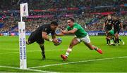 14 October 2023; Ardie Savea of New Zealand dives over to score his side's second try, in the 34th minute, despite the efforts of Ireland's James Lowe, during the 2023 Rugby World Cup quarter-final match between Ireland and New Zealand at the Stade de France in Paris, France. Photo by Ramsey Cardy/Sportsfile
