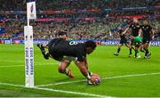 14 October 2023; Ardie Savea of New Zealand dives over to score his side's second try, in the 34th minute, despite the efforts of Ireland's James Lowe, during the 2023 Rugby World Cup quarter-final match between Ireland and New Zealand at the Stade de France in Paris, France. Photo by Ramsey Cardy/Sportsfile