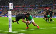 14 October 2023; Ardie Savea of New Zealand dives over to score his side's second try, in the 34th minute, despite the efforts of Ireland's James Lowe, during the 2023 Rugby World Cup quarter-final match between Ireland and New Zealand at the Stade de France in Paris, France. Photo by Ramsey Cardy/Sportsfile