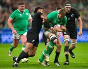 14 October 2023; Iain Henderson of Ireland is tackled by Rieko Ioane of New Zealand, left, during the 2023 Rugby World Cup quarter-final match between Ireland and New Zealand at the Stade de France in Paris, France. Photo by Brendan Moran/Sportsfile