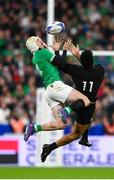 14 October 2023; Mack Hansen of Ireland and Leicester Fainga'anuku of New Zealand compete for the ball during the 2023 Rugby World Cup quarter-final match between Ireland and New Zealand at the Stade de France in Paris, France. Photo by Ramsey Cardy/Sportsfile