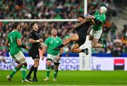 14 October 2023; Mack Hansen of Ireland and Leicester Fainga'anuku of New Zealand compete for the ball during the 2023 Rugby World Cup quarter-final match between Ireland and New Zealand at the Stade de France in Paris, France. Photo by Brendan Moran/Sportsfile