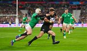 14 October 2023; Beauden Barrett of New Zealand is tackled by Mack Hansen of Ireland during the 2023 Rugby World Cup quarter-final match between Ireland and New Zealand at the Stade de France in Paris, France. Photo by Ramsey Cardy/Sportsfile