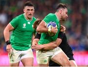 14 October 2023; Hugo Keenan of Ireland is tackled by Sam Cane of New Zealand during the 2023 Rugby World Cup quarter-final match between Ireland and New Zealand at the Stade de France in Paris, France. Photo by Ramsey Cardy/Sportsfile