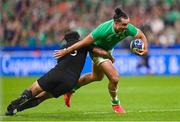 14 October 2023; James Lowe of Ireland is tackled by Rieko Ioane of New Zealand during the 2023 Rugby World Cup quarter-final match between Ireland and New Zealand at the Stade de France in Paris, France. Photo by Ramsey Cardy/Sportsfile