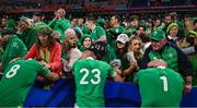 14 October 2023; Ireland players, from left, Caelan Doris, Jimmy O'Brien and Andrew Porter are consoled by family members after their side's defeat in the 2023 Rugby World Cup quarter-final match between Ireland and New Zealand at the Stade de France in Paris, France. Photo by Brendan Moran/Sportsfile