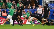 14 October 2023; Hugo Keenan of Ireland is tackled by Sam Cane of New Zealand during the 2023 Rugby World Cup quarter-final match between Ireland and New Zealand at the Stade de France in Paris, France. Photo by Harry Murphy/Sportsfile