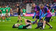 14 October 2023; Mack Hansen of Ireland receives treatment during the 2023 Rugby World Cup quarter-final match between Ireland and New Zealand at the Stade de France in Paris, France. Photo by Ramsey Cardy/Sportsfile