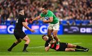 14 October 2023; James Lowe of Ireland is tackled by Will Jordan, left, and Beauden Barrett of New Zealand during the 2023 Rugby World Cup quarter-final match between Ireland and New Zealand at the Stade de France in Paris, France. Photo by Harry Murphy/Sportsfile