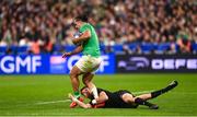 14 October 2023; James Lowe of Ireland is tackled by Beauden Barrett of New Zealand during the 2023 Rugby World Cup quarter-final match between Ireland and New Zealand at the Stade de France in Paris, France. Photo by Harry Murphy/Sportsfile