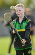 15 October 2023; Young Kilcormac-Killoughey supporter Éanna Gorman, age 8, pucks around on the pitch before the Offaly County Senior Club Hurling Championship final match between Kilcormac-Killoughey and Shinrone at Grant Heating St Brendan's Park in Birr, Offaly. Photo by Seb Daly/Sportsfile