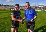15 October 2023; Referee Brian Higgins with Kilcoo captain Darryl Branagan before the Down County Senior Club Football Championship final match between Burren and Kilcoo at Pairc Esler in Newry, Down. Photo by Ben McShane/Sportsfile