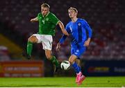 14 October 2023; Luca Cailloce of Republic of Ireland in action against Porri Heißar Bergmann of Iceland during the UEFA European U17 Championship qualifying round 10 match between Republic of Ireland and Iceland at Turner's Cross in Cork. Photo by Eóin Noonan/Sportsfile