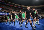 14 October 2023; New Zealand captain Sam Cane and Ireland captain Jonathan Sexton lead their teams out before the 2023 Rugby World Cup quarter-final match between Ireland and New Zealand at the Stade de France in Paris, France. Photo by Ramsey Cardy/Sportsfile