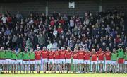 15 October 2023; Loughgiel Shamrocks players observe a moment of silence in honour of the late Olympic boxer and photographer Hugh Russell during the Antrim County Senior Club Hurling Championship final match between Ruairi Og Cushendall and Loughgiel Shamrocks at Corrigan Park in Belfast. Photo by David Fitzgerald/Sportsfile