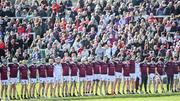 15 October 2023; Ruairi Og Cushendall players observe a moment of silence in honour of the late Olympic boxer and photographer Hugh Russell during the Antrim County Senior Club Hurling Championship final match between Ruairi Og Cushendall and Loughgiel Shamrocks at Corrigan Park in Belfast. Photo by David Fitzgerald/Sportsfile