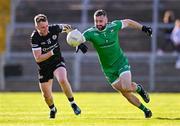 15 October 2023; Burren goalkeeper Kevin McKernan in action against Paul Devlin of Kilcoo during the Down County Senior Club Football Championship final match between Burren and Kilcoo at Pairc Esler in Newry, Down. Photo by Ben McShane/Sportsfile