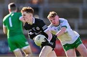 15 October 2023; MacDarragh Hynes of Kilcoo in action against Darra Mussen of Burren during the Down County Senior Club Football Championship final match between Burren and Kilcoo at Pairc Esler in Newry, Down. Photo by Ben McShane/Sportsfile