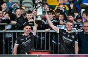 15 October 2023; Kilcoo joint-captains Darryl Branagan, left, and Aaron Morgan lifts the cup after the Down County Senior Club Football Championship final match between Burren and Kilcoo at Pairc Esler in Newry, Down. Photo by Ben McShane/Sportsfile
