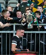 15 October 2023; Young Kilcoo supporters lift the cup after the Down County Senior Club Football Championship final match between Burren and Kilcoo at Pairc Esler in Newry, Down. Photo by Ben McShane/Sportsfile