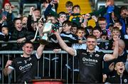 15 October 2023; Kilcoo joint-captains Darryl Branagan, left, and Aaron Morgan lifts the cup after the Down County Senior Club Football Championship final match between Burren and Kilcoo at Pairc Esler in Newry, Down. Photo by Ben McShane/Sportsfile