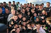 15 October 2023; Kilcoo players and supporters celebrate with the cup after the Down County Senior Club Football Championship final match between Burren and Kilcoo at Pairc Esler in Newry, Down. Photo by Ben McShane/Sportsfile