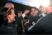 15 October 2023; Kilcoo manager Karl Lacey celebrates with son Naoise and mother Deborah, left, after the Down County Senior Club Football Championship final match between Burren and Kilcoo at Pairc Esler in Newry, Down. Photo by Ben McShane/Sportsfile