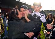 15 October 2023; Kilcoo manager Karl Lacey celebrates with son Naoise and mother Deborah, left, after the Down County Senior Club Football Championship final match between Burren and Kilcoo at Pairc Esler in Newry, Down. Photo by Ben McShane/Sportsfile
