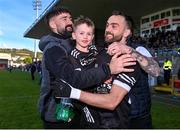 15 October 2023; Conor Laverty of Kilcoo celebrates with his son Fiachra after the Down County Senior Club Football Championship final match between Burren and Kilcoo at Pairc Esler in Newry, Down. Photo by Ben McShane/Sportsfile