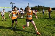 15 October 2023; Cian Manning of Leevale AC, Cork,  takes the baton from team-mate Luke Merrigan whilst competing in the boys U15 4x1000m relay during the Autumn Open International Cross Country Festival & The Athletics Ireland Cross County Xperience at Abbotstown in Dublin. Photo by Sam Barnes/Sportsfile