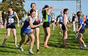 15 October 2023; Erin Finn of Ratoath AC, Meath, takes the baton from team-mate Lily Flood whilst competing in the U15 girls 4x1000m relay during the Autumn Open International Cross Country Festival & The Athletics Ireland Cross County Xperience at Abbotstown in Dublin. Photo by Sam Barnes/Sportsfile