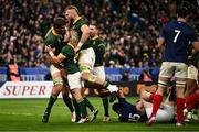 15 October 2023; Eben Etzebeth of South Africa, left, celebates with team-mates after scoring their side's third try during the 2023 Rugby World Cup quarter-final match between France and South Africa at the Stade de France in Paris, France. Photo by Harry Murphy/Sportsfile