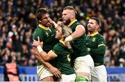 15 October 2023; Eben Etzebeth of South Africa, left, celebrates with teammates Faf de Klerk, RG Snyman and Willie Le Roux after scoring his side's fourth try during the 2023 Rugby World Cup quarter-final match between France and South Africa at the Stade de France in Paris, France. Photo by Harry Murphy/Sportsfile