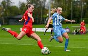 30 September 2023; Kerri Letmon of Shelbourne in action against Nicole Keogh of DLR Waves during the SSE Airtricity Women's Premier Division match between DLR Waves FC and Shelbourne FC at UCD Bowl in Dublin. Photo by Tyler Miller/Sportsfile