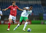 16 October 2023; Chiedozie Ogbene of Republic of Ireland in action against Ethan Britto of Gibraltar during the UEFA EURO 2024 Championship qualifying group B match between Gibraltar and Republic of Ireland at Estádio Algarve in Faro, Portugal. Photo by Stephen McCarthy/Sportsfile