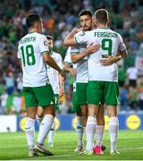 16 October 2023; Evan Ferguson of Republic of Ireland, 9, with teammates including Matt Doherty, centre, and Jamie McGrath, left, after scoring their side's first goal during the UEFA EURO 2024 Championship qualifying group B match between Gibraltar and Republic of Ireland at Estádio Algarve in Faro, Portugal. Photo by Stephen McCarthy/Sportsfile