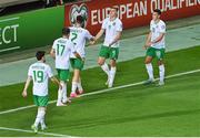 16 October 2023; Evan Ferguson of Republic of Ireland celebrates with teammates, including Jamie McGrath, right, and Matt Doherty, 2, during the UEFA EURO 2024 Championship qualifying group B match between Gibraltar and Republic of Ireland at Estádio Algarve in Faro, Portugal. Photo by Seb Daly/Sportsfile