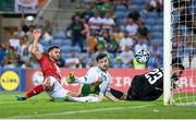 16 October 2023; Mikey Johnston of Republic of Ireland scores his side's second goal past Gibraltar goalkeeper Dayle Coleing during the UEFA EURO 2024 Championship qualifying group B match between Gibraltar and Republic of Ireland at Estádio Algarve in Faro, Portugal. Photo by Stephen McCarthy/Sportsfile
