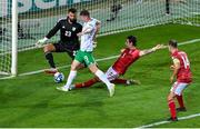 16 October 2023; Evan Ferguson of Republic of Ireland in action against Louie Annesley, second from right, and Gibraltar goalkeeper Dayle Coleing during the UEFA EURO 2024 Championship qualifying group B match between Gibraltar and Republic of Ireland at Estádio Algarve in Faro, Portugal. Photo by Seb Daly/Sportsfile
