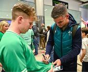 16 October 2023; Captain Jonathan Sexton signs an autograph on the Ireland rugby teams arrival at Dublin Airport from the 2023 Rugby World Cup in France. Photo by Piaras Ó Mídheach/Sportsfile