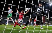 16 October 2023; Evan Ferguson of Republic of Ireland scores his side's first goal past Gibraltar goalkeeper Dayle Coleing during the UEFA EURO 2024 Championship qualifying group B match between Gibraltar and Republic of Ireland at Estádio Algarve in Faro, Portugal. Photo by Stephen McCarthy/Sportsfile