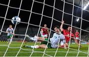 16 October 2023; Mikey Johnston of Republic of Ireland scores his side's second goal despite the attention of John Sergeant of Gibraltar during the UEFA EURO 2024 Championship qualifying group B match between Gibraltar and Republic of Ireland at Estádio Algarve in Faro, Portugal. Photo by Stephen McCarthy/Sportsfile